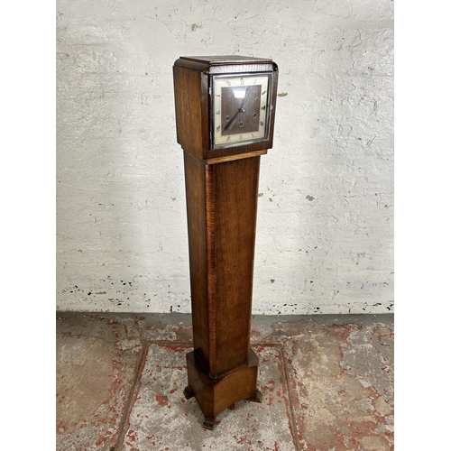 117 - An Art Deco oak cased Westminster chime granddaughter clock with key and pendulum - approx. 142cm hi... 