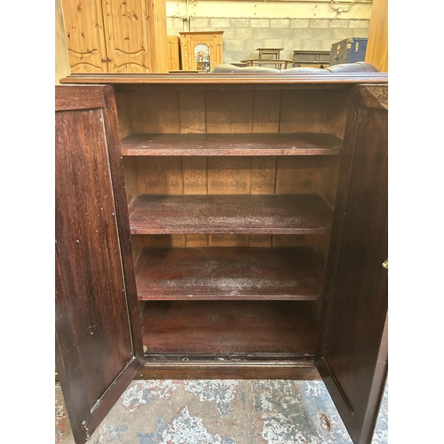 121 - A late 19th/early 20th century mahogany two door cabinet - approx. 82cm high x 69cm wide x 35cm deep