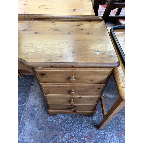 122 - A Ducal Victoria pine nine drawer dressing table - approx. 79cm high x 146cm wide x 45cm deep