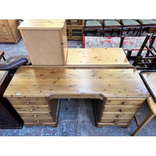 122 - A Ducal Victoria pine nine drawer dressing table - approx. 79cm high x 146cm wide x 45cm deep