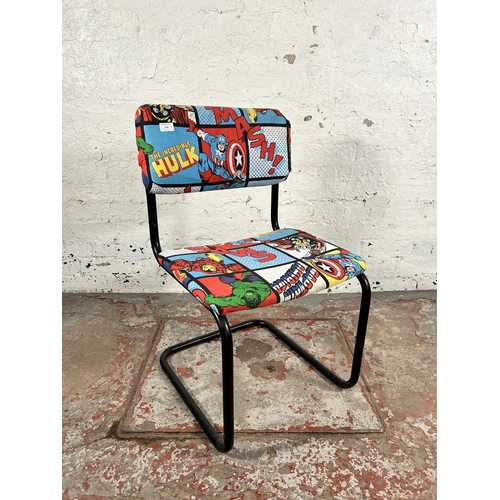 124 - A Marvel fabric upholstered and black tubular metal cantilever desk chair