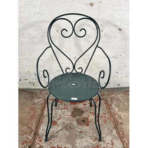 125 - A Victorian style green metal patio armchair