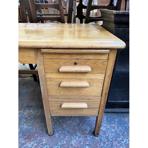 126 - A mid 20th century Abbess oak three drawer office desk - approx. 71cm high x 106cm wide x 60cm deep