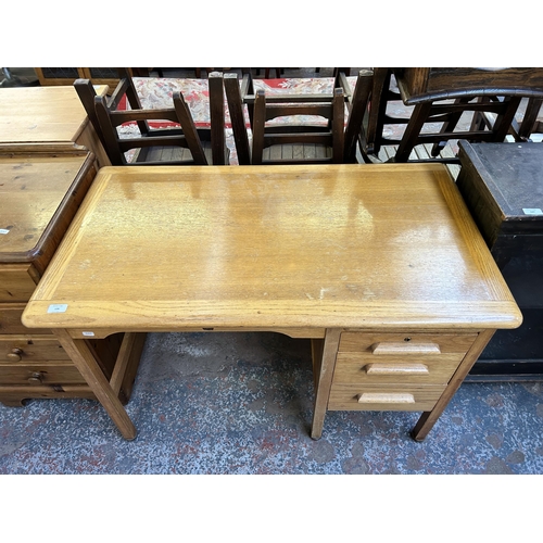 126 - A mid 20th century Abbess oak three drawer office desk - approx. 71cm high x 106cm wide x 60cm deep