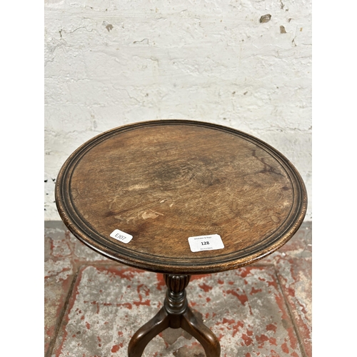 128 - A 19th century mahogany circular tripod wine table - approx. 64cm high x 36cm in diameter