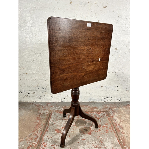 129 - A late 18th/early 19th century mahogany tilt top tripod occasional table - approx. 101cm high x 58cm... 