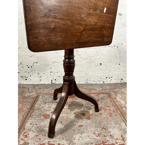 129 - A late 18th/early 19th century mahogany tilt top tripod occasional table - approx. 101cm high x 58cm... 