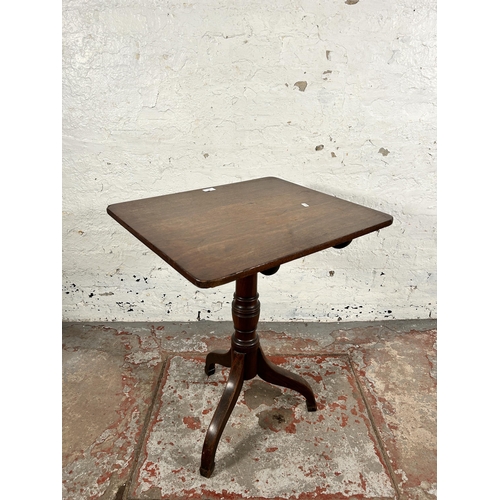 129 - A late 18th/early 19th century mahogany tilt top tripod occasional table - approx. 101cm high x 58cm... 