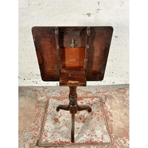 129 - A late 18th/early 19th century mahogany tilt top tripod occasional table - approx. 101cm high x 58cm... 