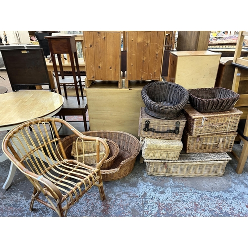 133 - Eleven pieces of wicker furniture, ten baskets and one armchair