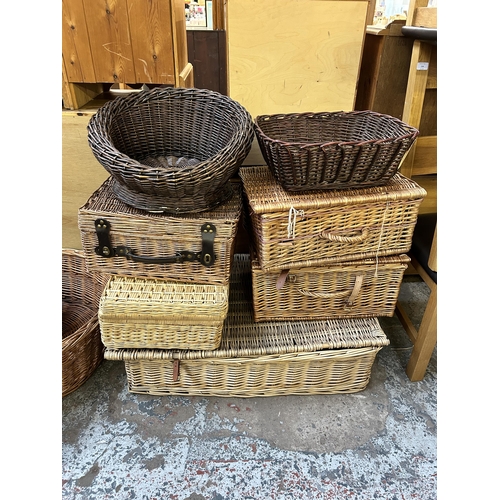 133 - Eleven pieces of wicker furniture, ten baskets and one armchair