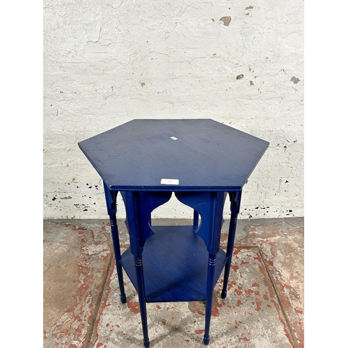 135 - A Middle Eastern blue painted hexagonal two tier occasional table - approx. 69cm high x 59cm wide x ... 