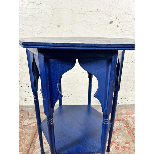 135 - A Middle Eastern blue painted hexagonal two tier occasional table - approx. 69cm high x 59cm wide x ... 