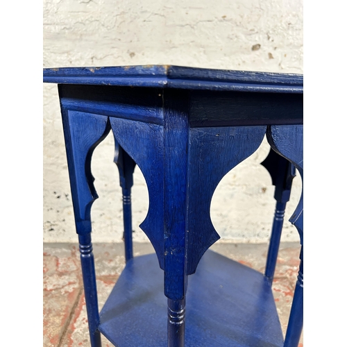 135 - A Middle Eastern blue painted hexagonal two tier occasional table - approx. 69cm high x 59cm wide x ... 