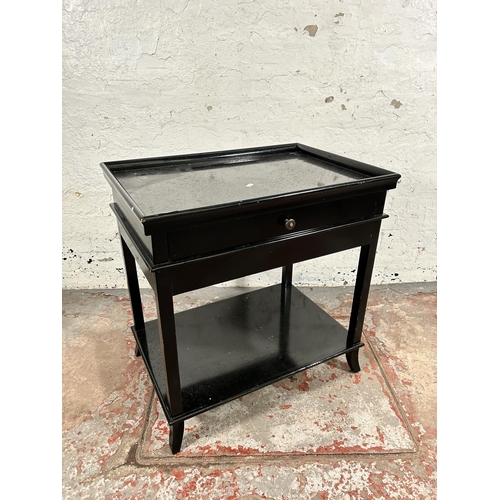 136 - A modern black painted single drawer two tier side table - approx. 67cm high x 65cm wide x 45cm deep