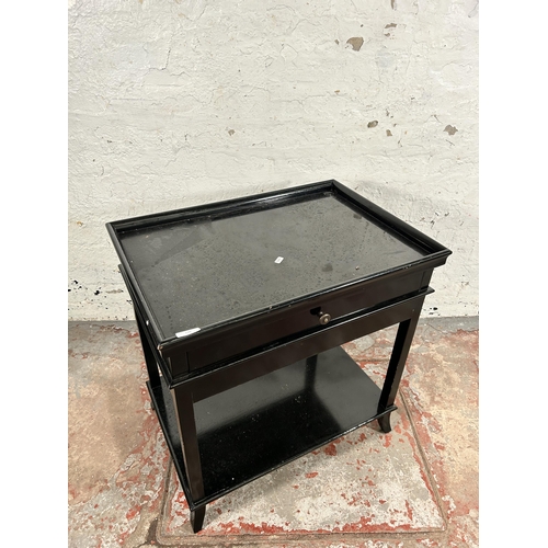 136 - A modern black painted single drawer two tier side table - approx. 67cm high x 65cm wide x 45cm deep