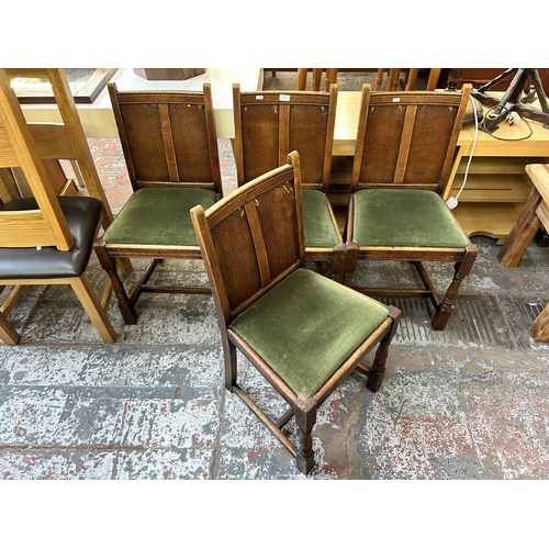 137 - Four 1930s carved oak and green fabric upholstered dining chairs