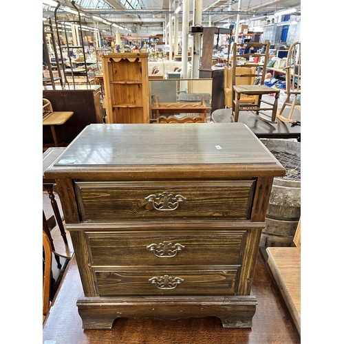 140 - A pine bedside chest of drawers - approx. 63cm high x 57cm wide x 36cm deep