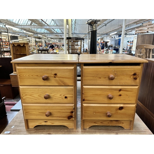 142 - A pair of pine bedside chests of drawers