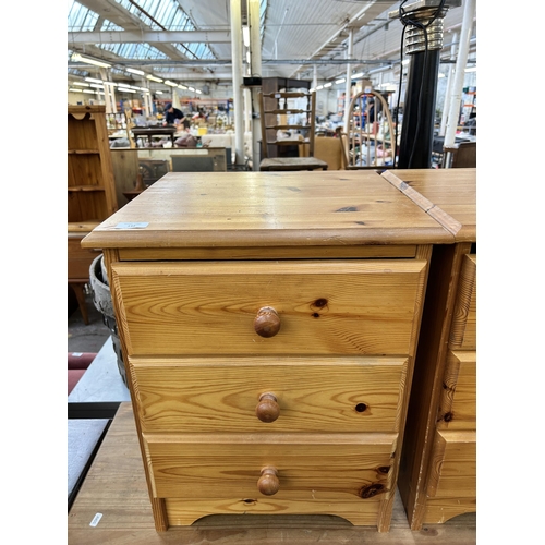 142 - A pair of pine bedside chests of drawers