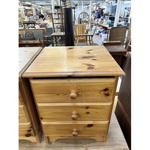 142 - A pair of pine bedside chests of drawers