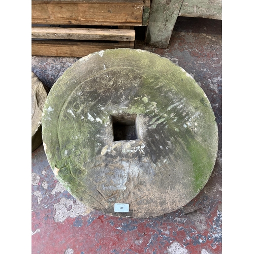 149 - Two antique sandstone grinding wheels, one 53cm diameter and one 34cm diameter