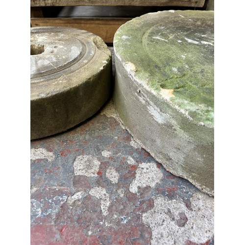 149 - Two antique sandstone grinding wheels, one 53cm diameter and one 34cm diameter