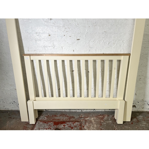 15 - A modern oak and white painted double bed frame - approx. 148cm wide