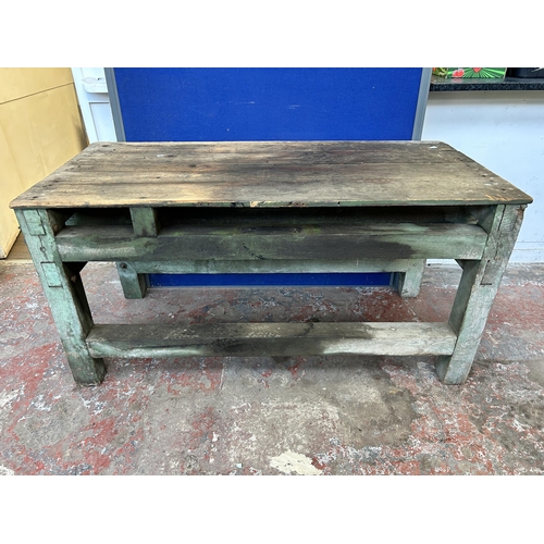 151 - An early 20th century green painted pine work bench - approx. 85cm high x 79cm wide x 170cm long