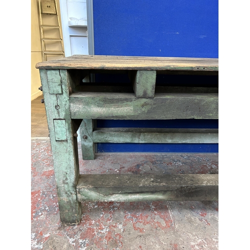 151 - An early 20th century green painted pine work bench - approx. 85cm high x 79cm wide x 170cm long