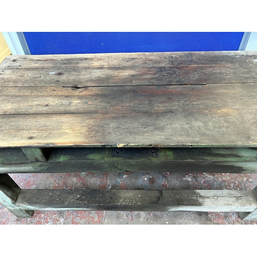 151 - An early 20th century green painted pine work bench - approx. 85cm high x 79cm wide x 170cm long