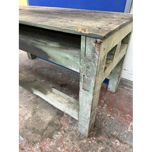 151 - An early 20th century green painted pine work bench - approx. 85cm high x 79cm wide x 170cm long