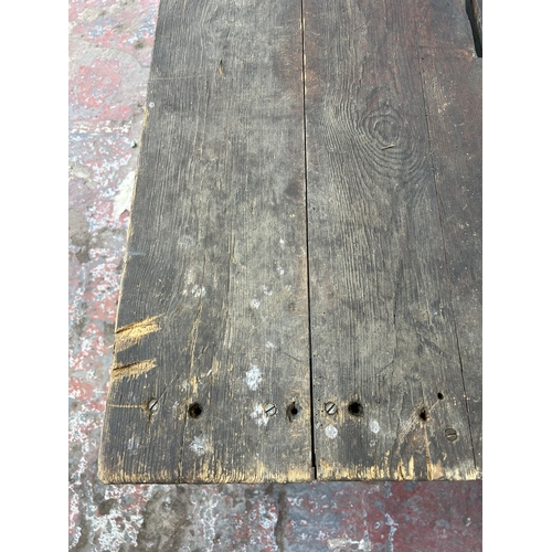 151 - An early 20th century green painted pine work bench - approx. 85cm high x 79cm wide x 170cm long