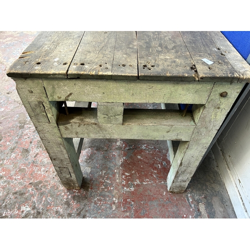 151 - An early 20th century green painted pine work bench - approx. 85cm high x 79cm wide x 170cm long