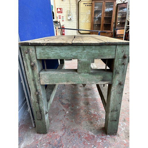 151 - An early 20th century green painted pine work bench - approx. 85cm high x 79cm wide x 170cm long