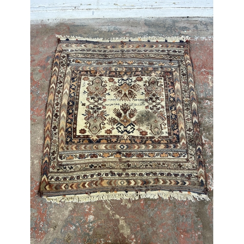 151B - An Afghan hand knotted rug - approx. 138cm x 125cm