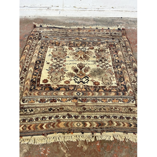 151B - An Afghan hand knotted rug - approx. 138cm x 125cm