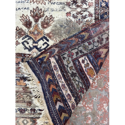 151B - An Afghan hand knotted rug - approx. 138cm x 125cm