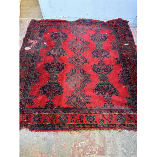 151E - A Persian hand knotted rug - approx. 315cm x 300cm