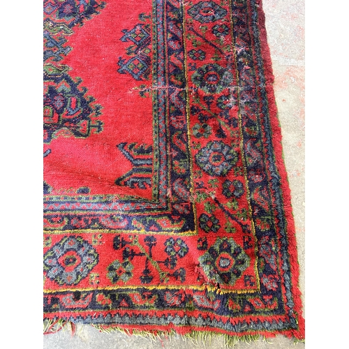 151E - A Persian hand knotted rug - approx. 315cm x 300cm