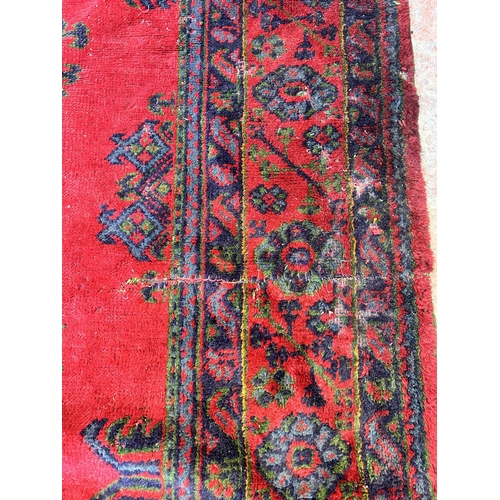 151E - A Persian hand knotted rug - approx. 315cm x 300cm