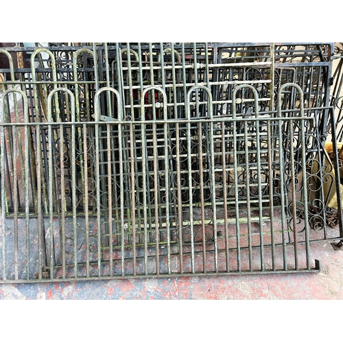 152 - A large quantity of cast and wrought iron garden gates and railings together with a box of hinges an... 