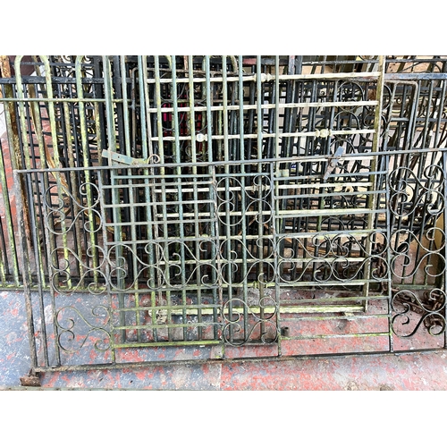 152 - A large quantity of cast and wrought iron garden gates and railings together with a box of hinges an... 