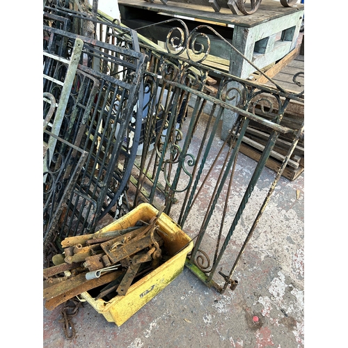 152 - A large quantity of cast and wrought iron garden gates and railings together with a box of hinges an... 