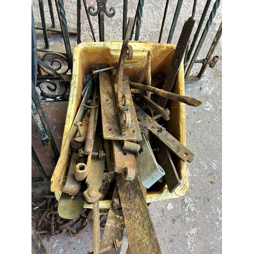 152 - A large quantity of cast and wrought iron garden gates and railings together with a box of hinges an... 