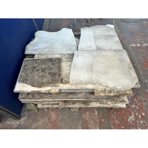 153 - A large quantity of marble and reconstituted stone slabs and off cuts