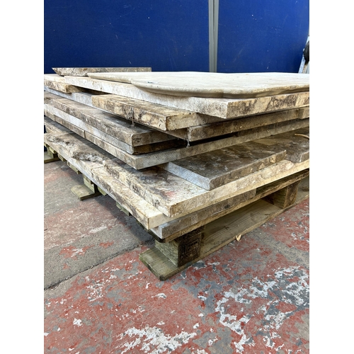 153 - A large quantity of marble and reconstituted stone slabs and off cuts