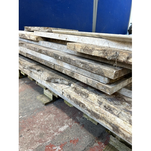 153 - A large quantity of marble and reconstituted stone slabs and off cuts