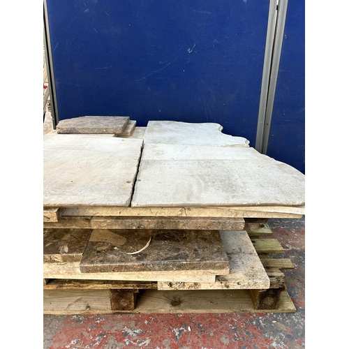 153 - A large quantity of marble and reconstituted stone slabs and off cuts