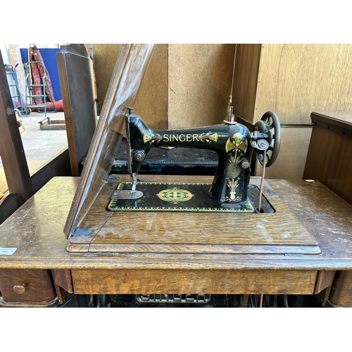 157 - A 1920 Singer cast iron and oak treadle sewing machine - serial no. F9848923